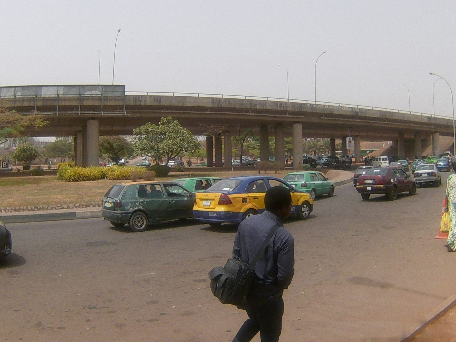 Taxis passing under a flyover in Abuja