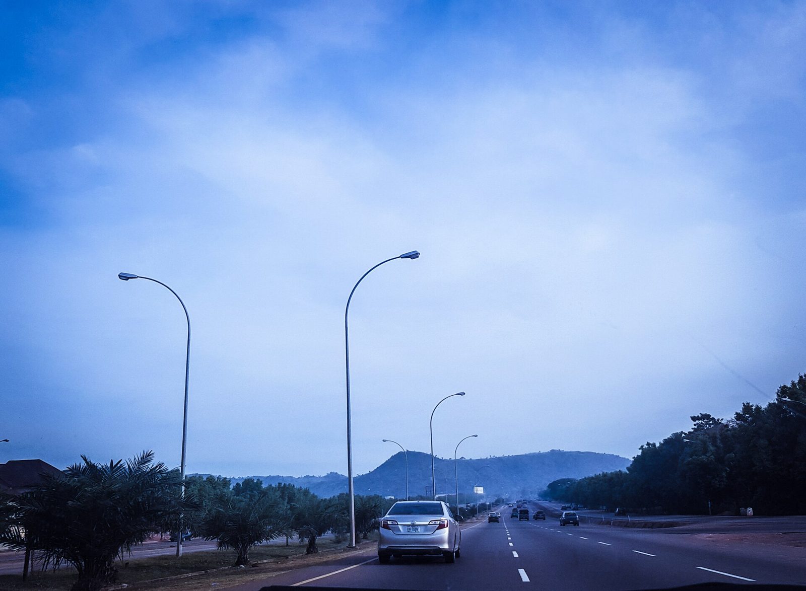 Abuja road under a big sky